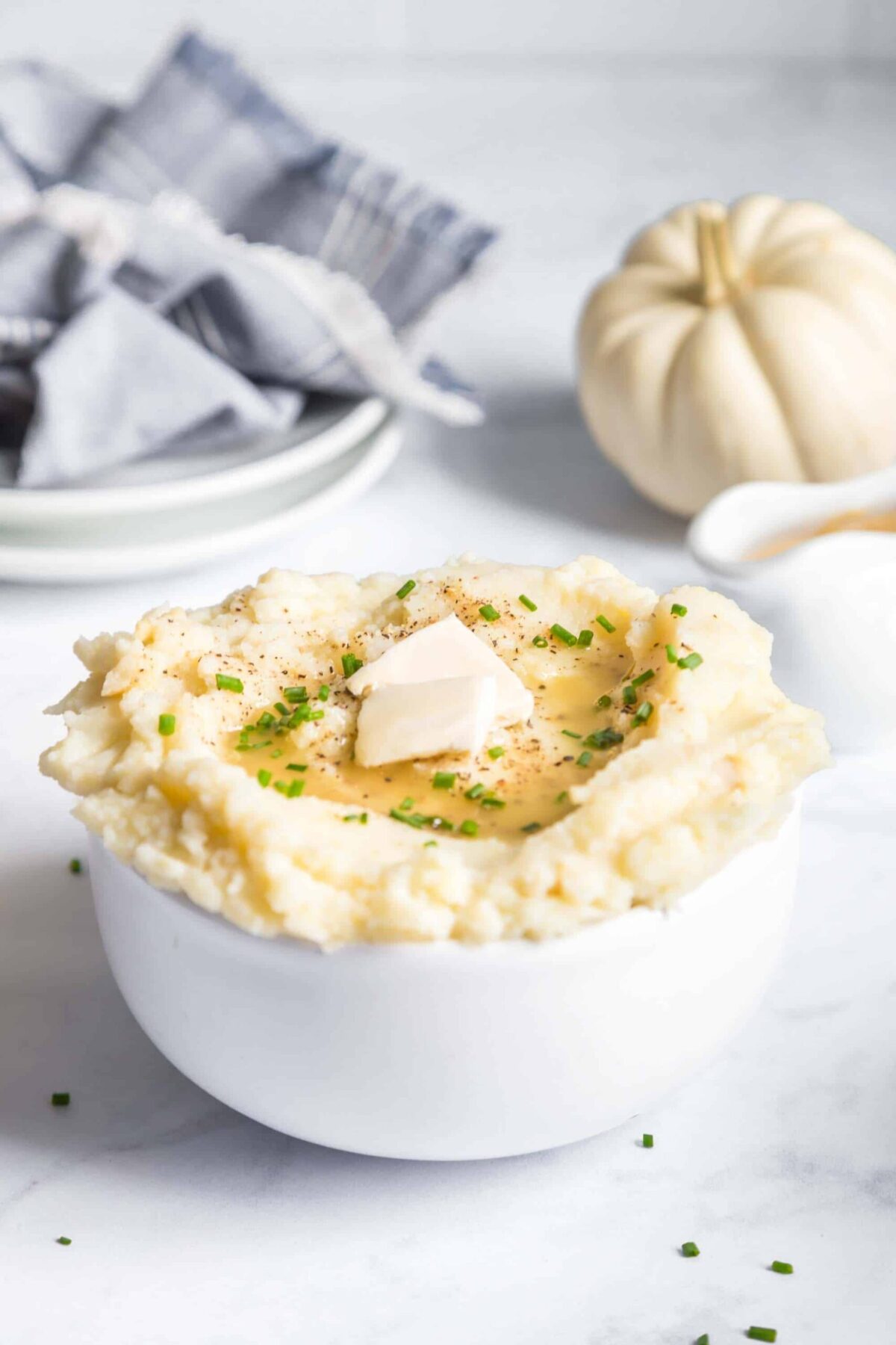 A bowl of fluffy, buttery vegan mashed potatoes.