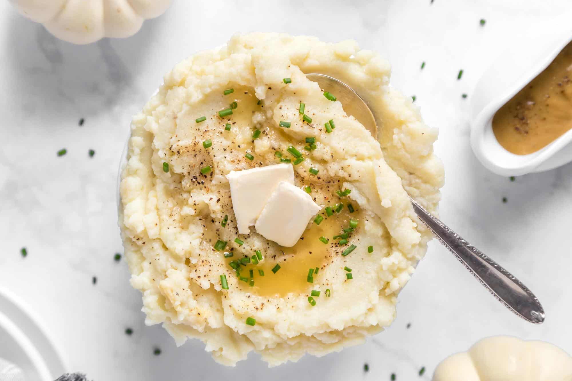 A plate of vegan mashed potatoes with vegan butter.