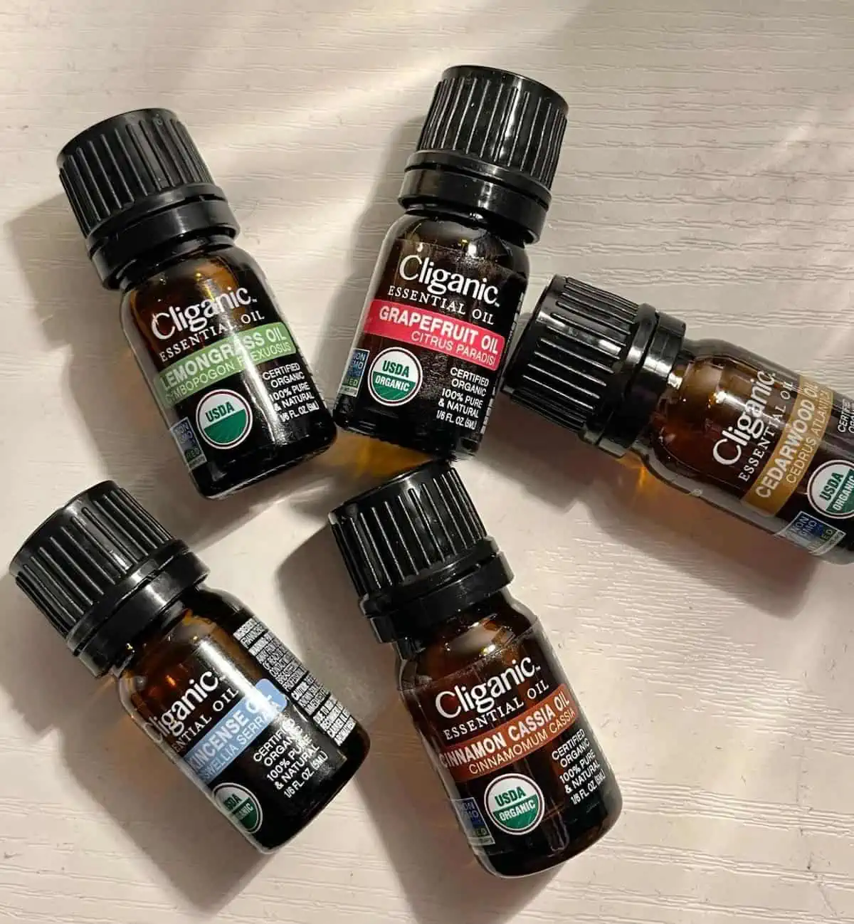 An array of essential oils in small containers.