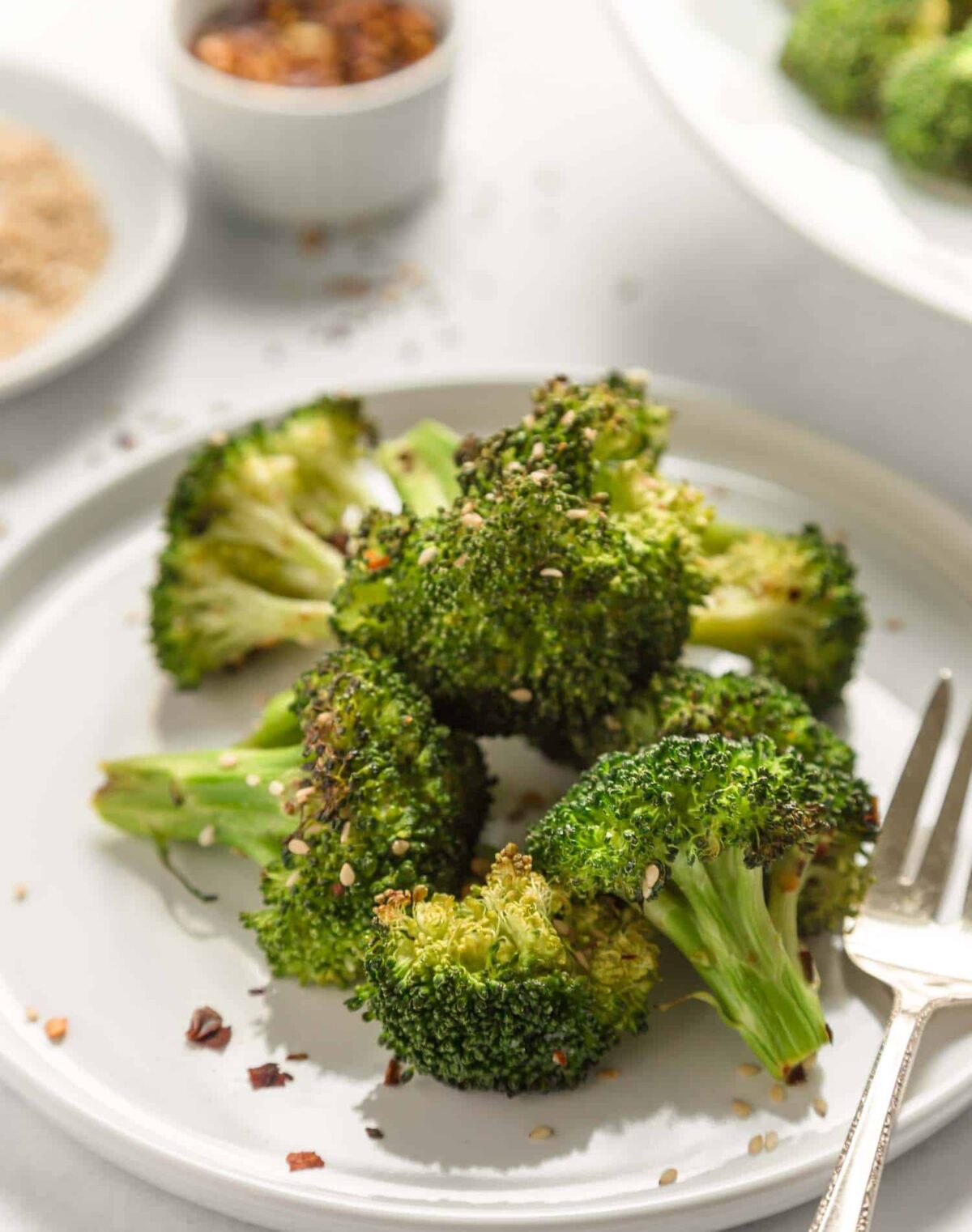 Air-fried broccoli on a plate.
