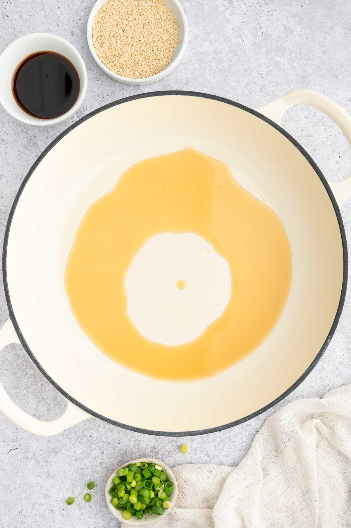 Oil being heated in a pan.