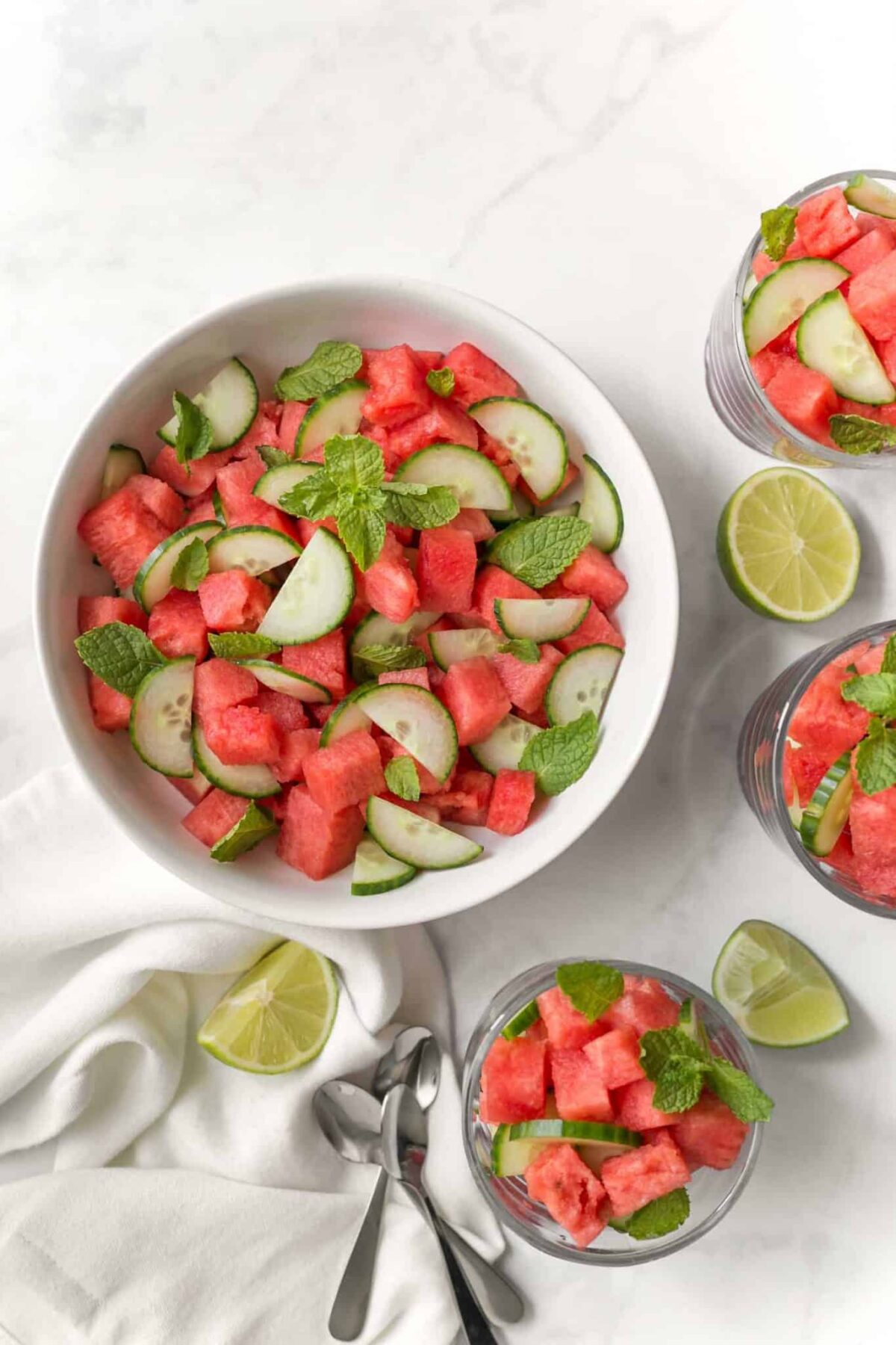 Easy cucumber and watermelon salad in bowls with fresh lime—cooling, hydrating, and great for BBQs.