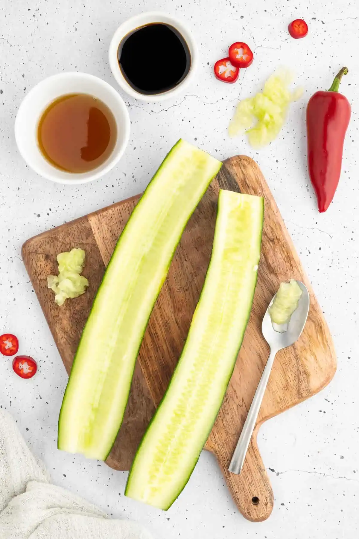 A cucumber sliced down the center to create two halves.
