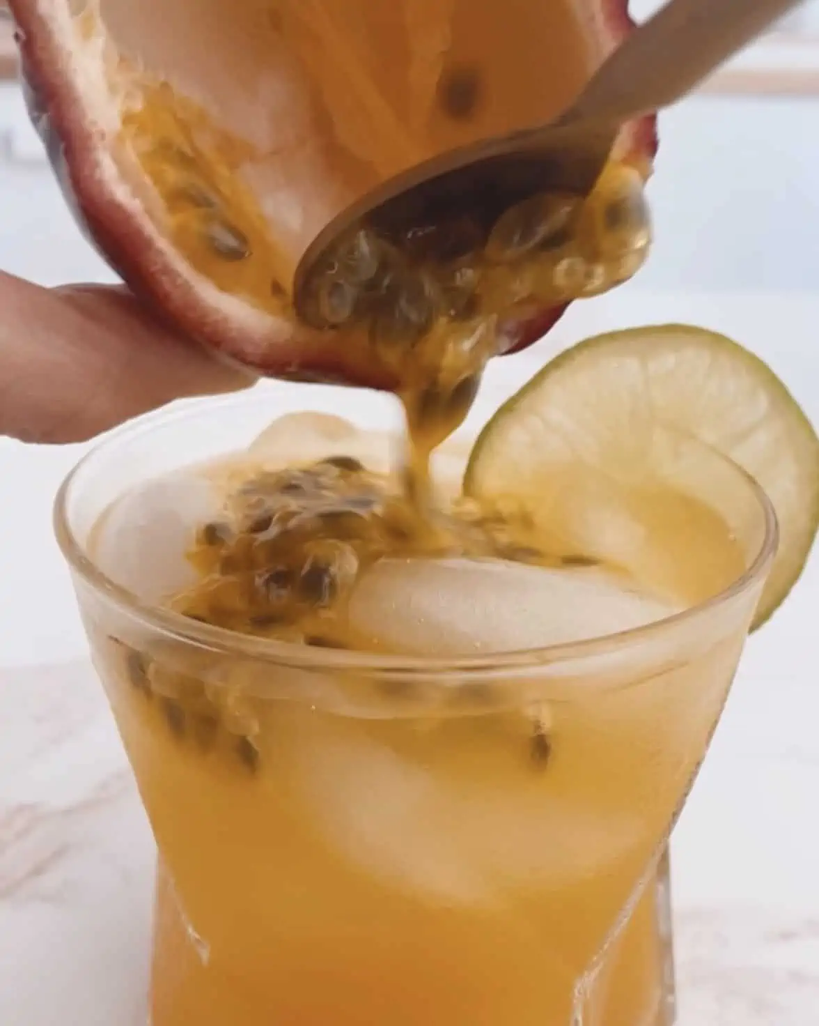 sparkling drink with fruit juice and lilikoi seeds