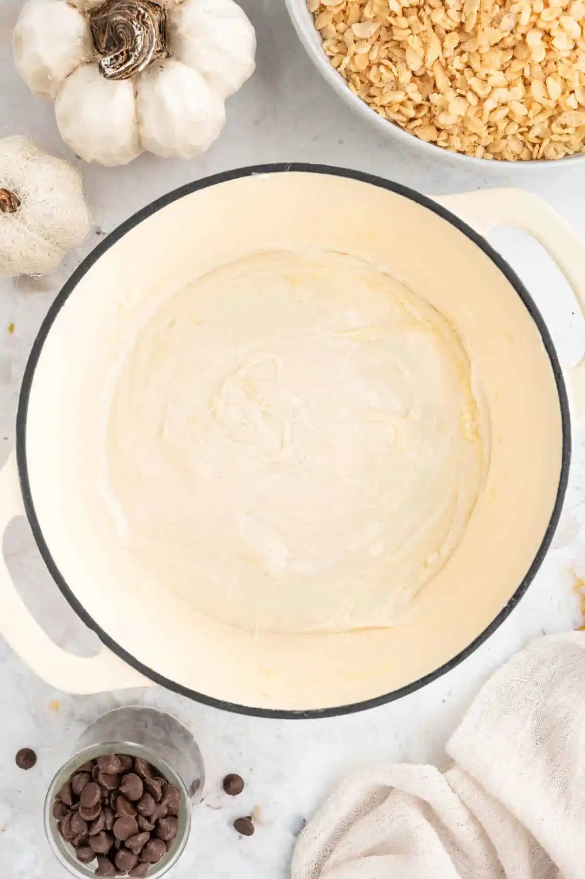 Melted vegan butter and marshmallows in a large pan.