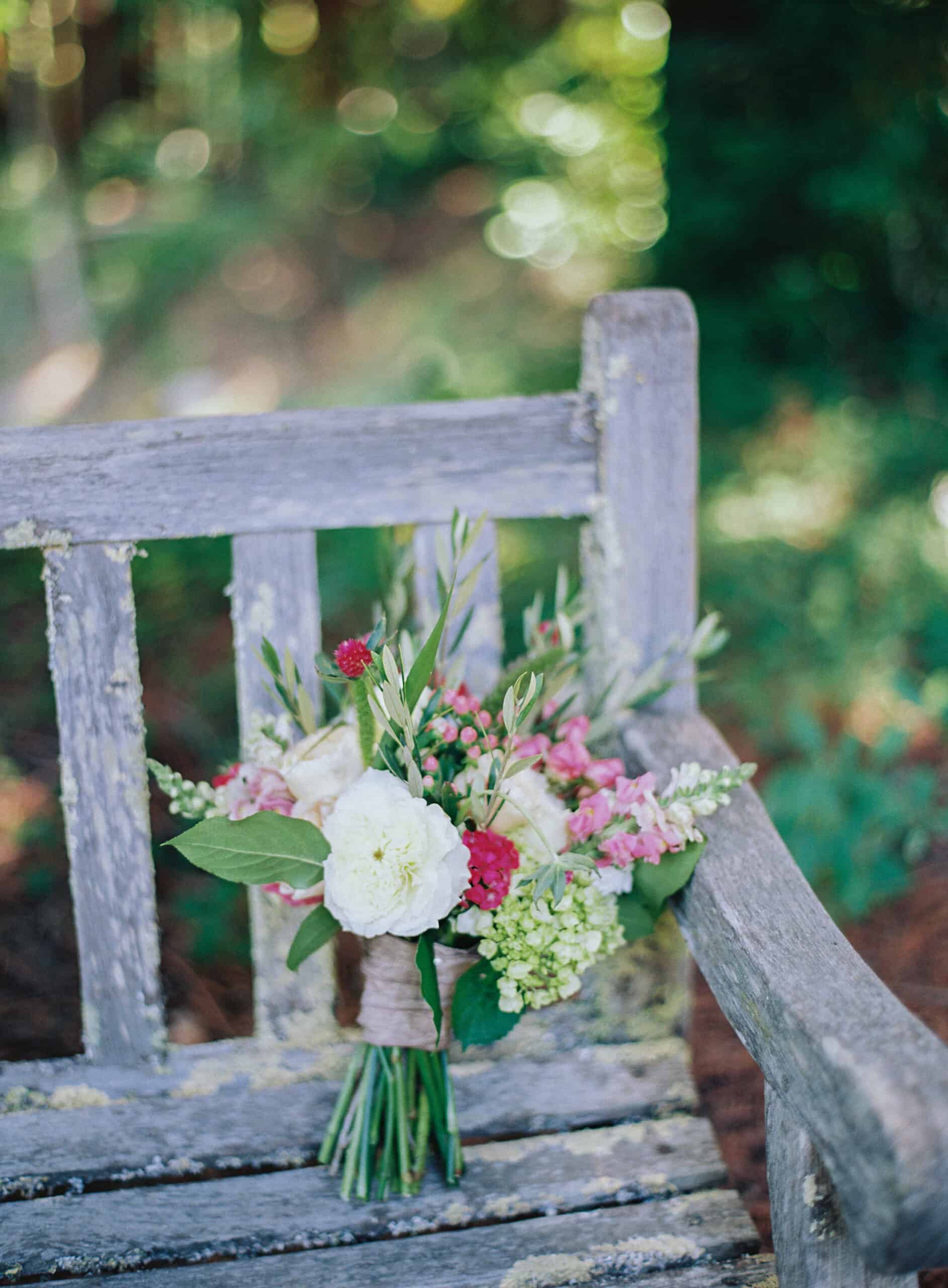Rustic wood bench with a colorful vegan wedding bouquet in Berkeley, California.
