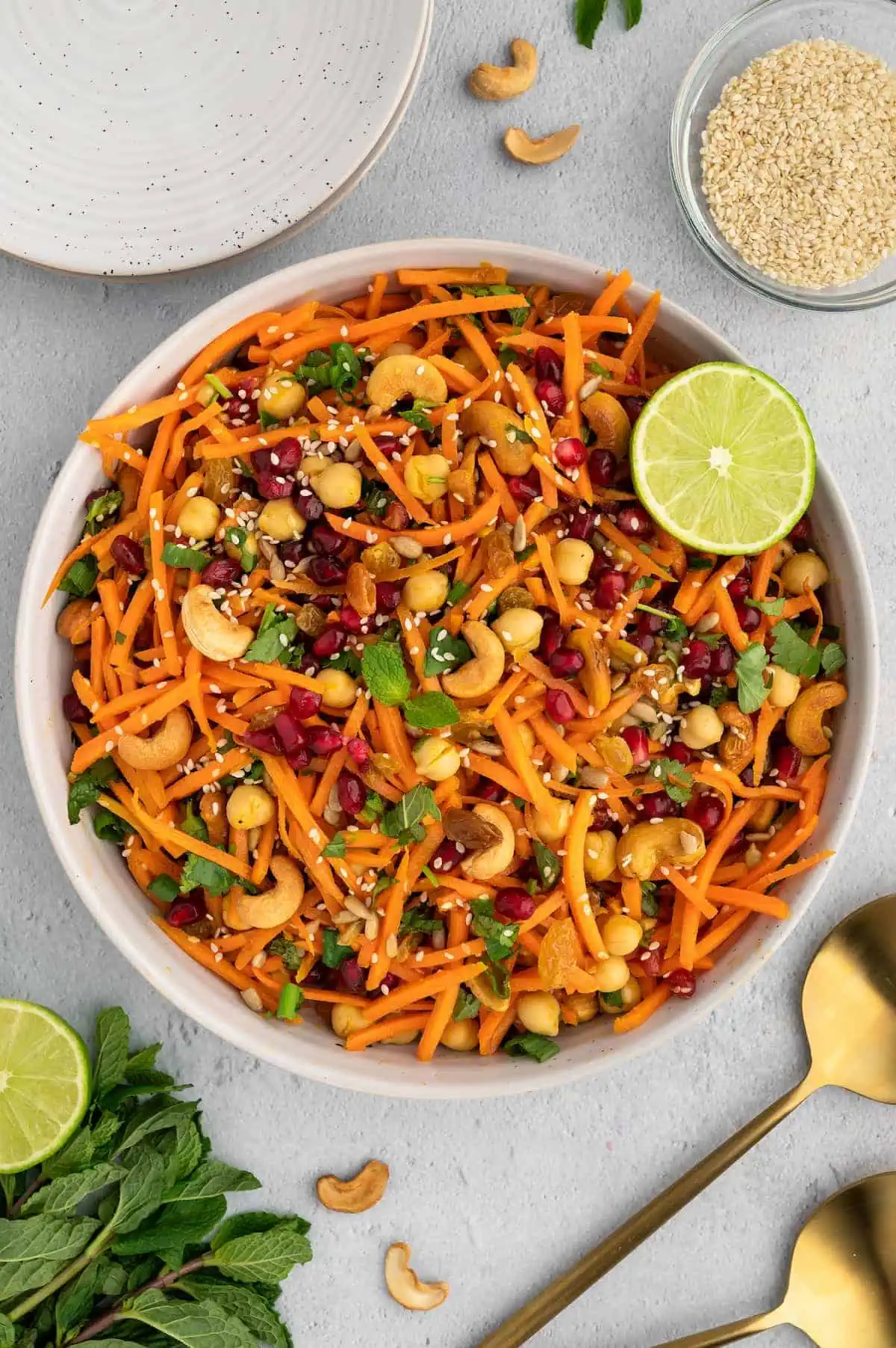 A Moroccan carrot salad in a large white serving bowl.
