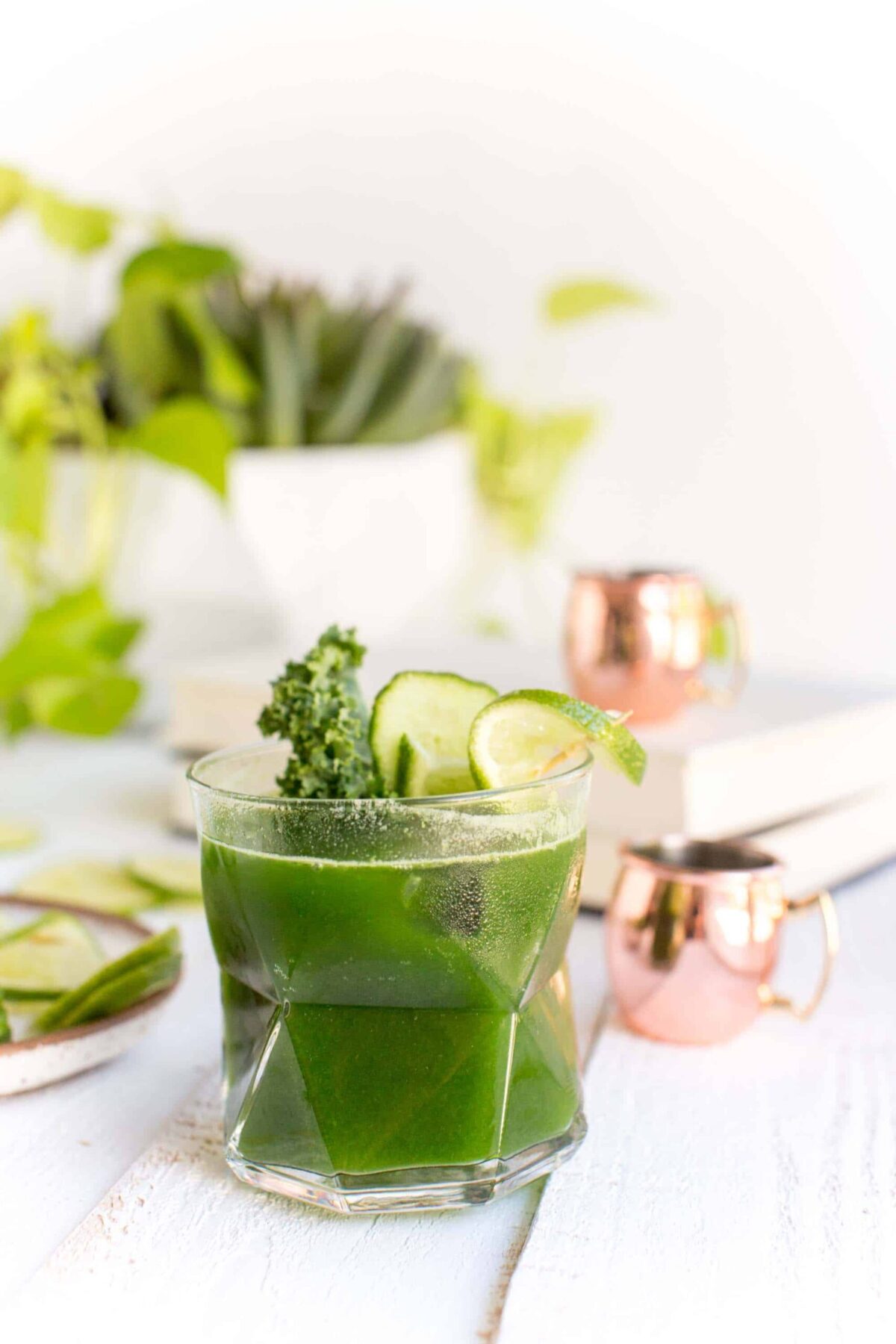 A kale cocktail, or a vegan Moscow mule, in a glass with garnish.