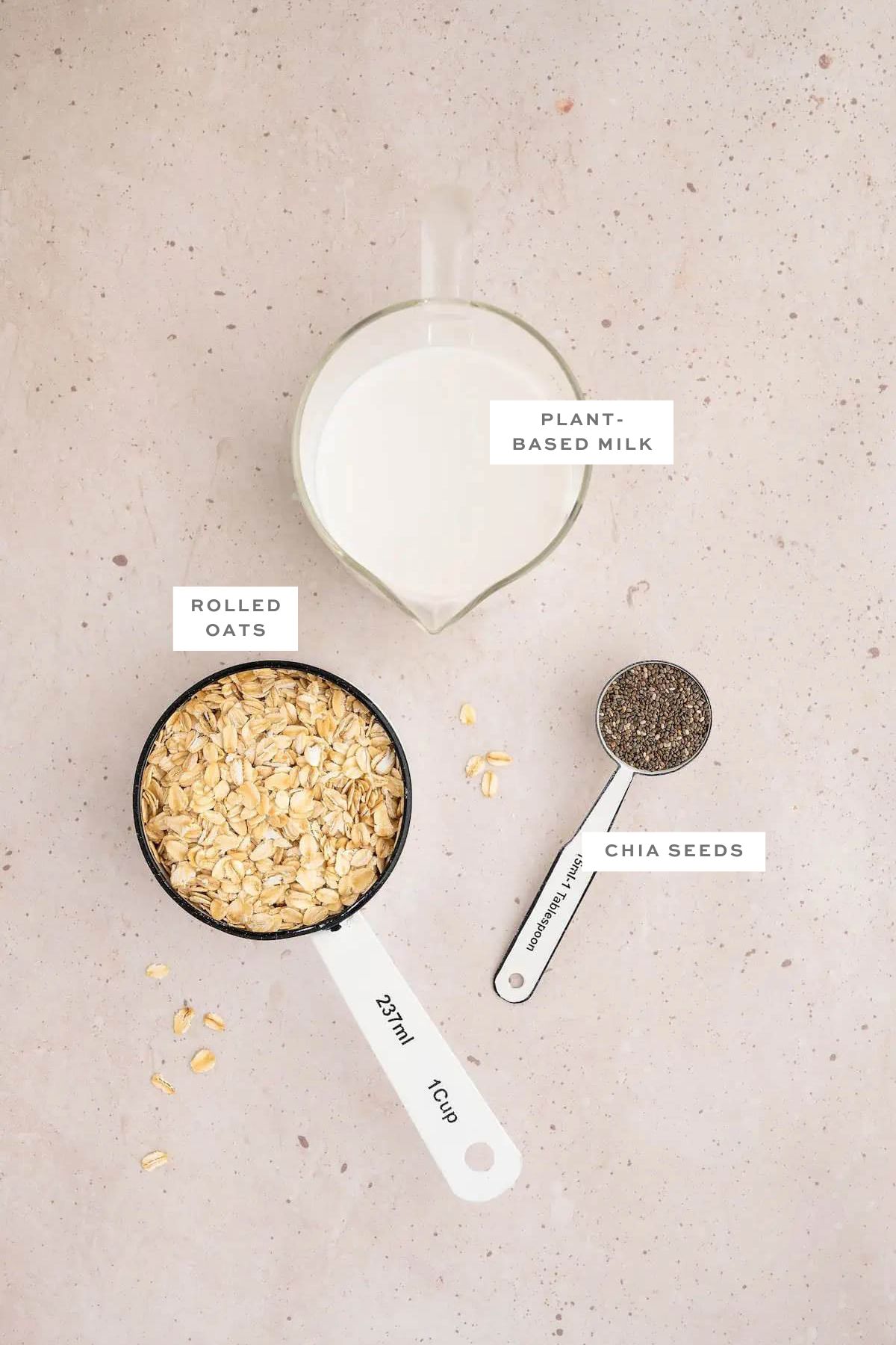 Key ingredients for vegan overnight oats with labels.