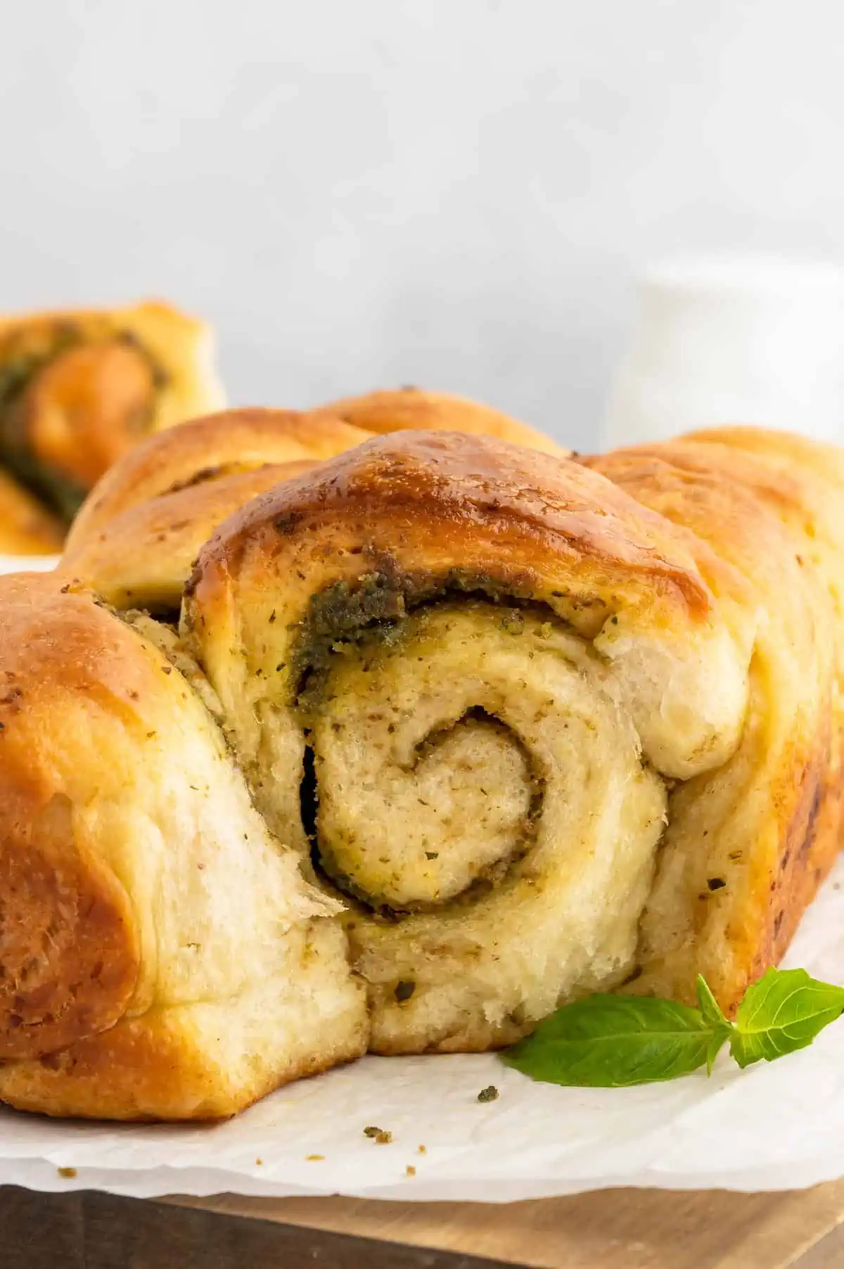 Vegan pesto pull-apart bread loaf with swirled green pesto layers.