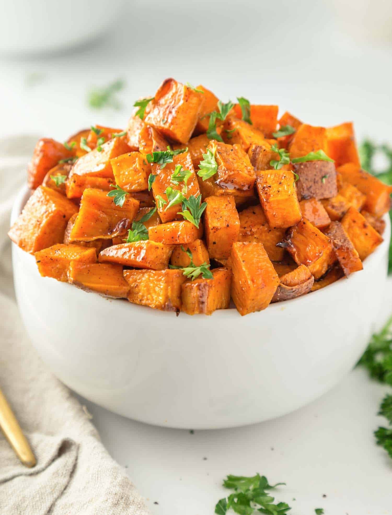 Roasted sweet potato cubes in a bowl.