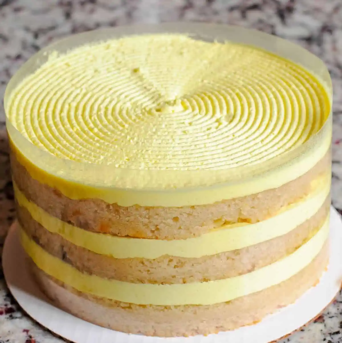 Three-layer lemon cake with frosting from Southern Roots Vegan Bakery delivery.