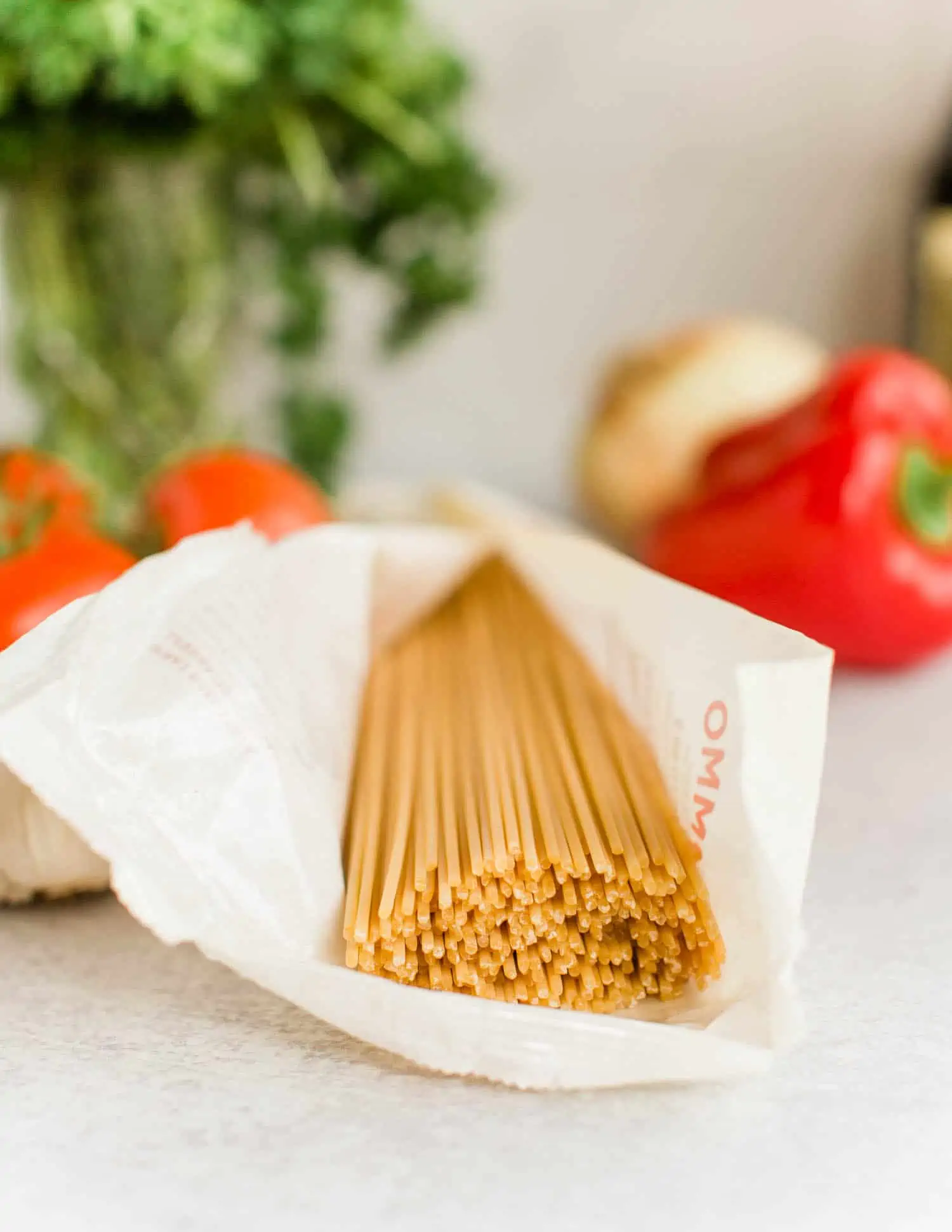 Open package of Rummo Italian spaghetti coming out of package from Magnifico Foods.