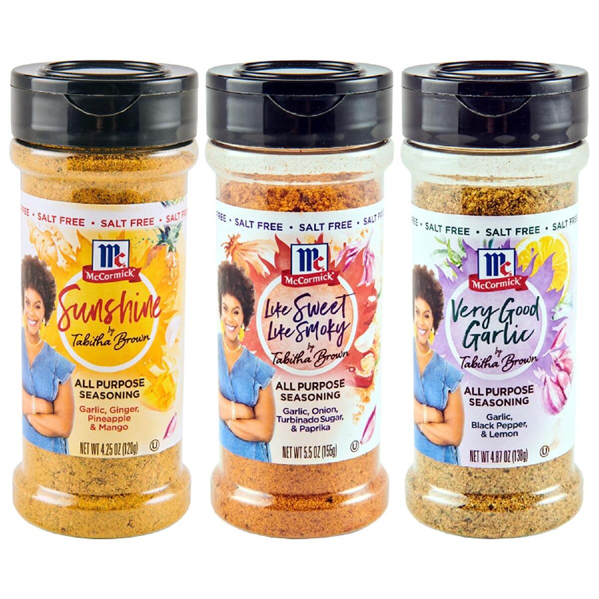 Three plastic bottles of Tabitha Brown all-purpose seasonings with black lids on a white background.
