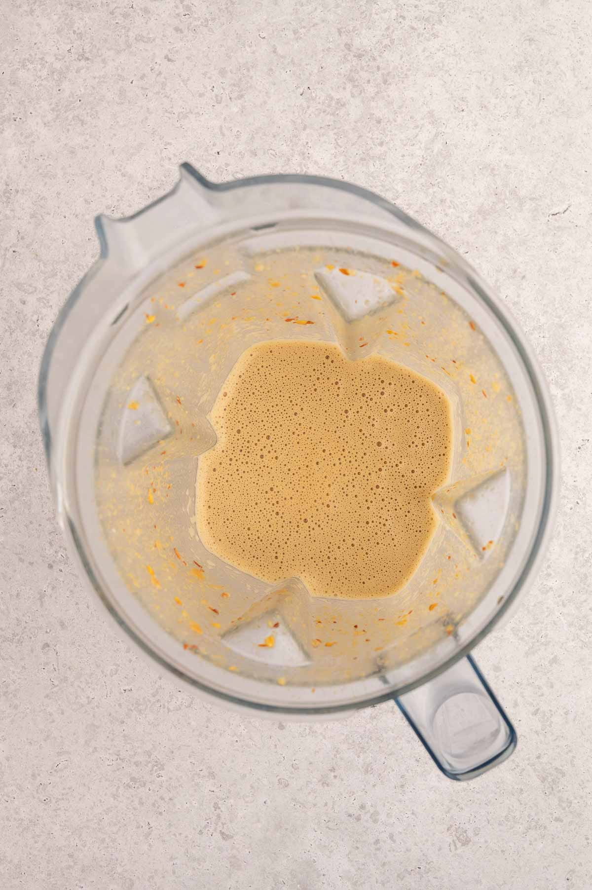 Thai peanut sauce ingredients in blender after mixing.