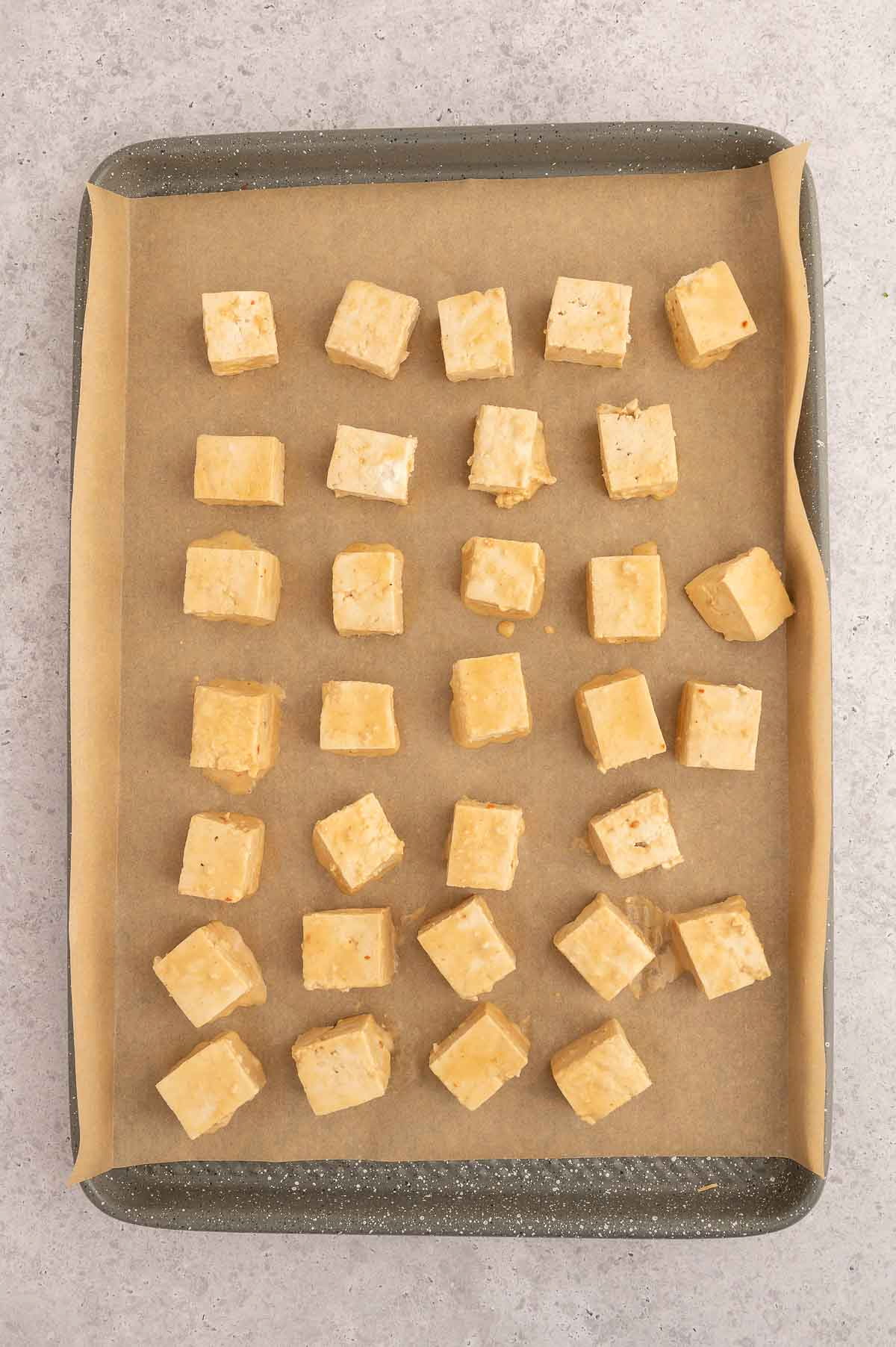 Cubed tofu pieces before baking for this Thai tofu peanut salad.
