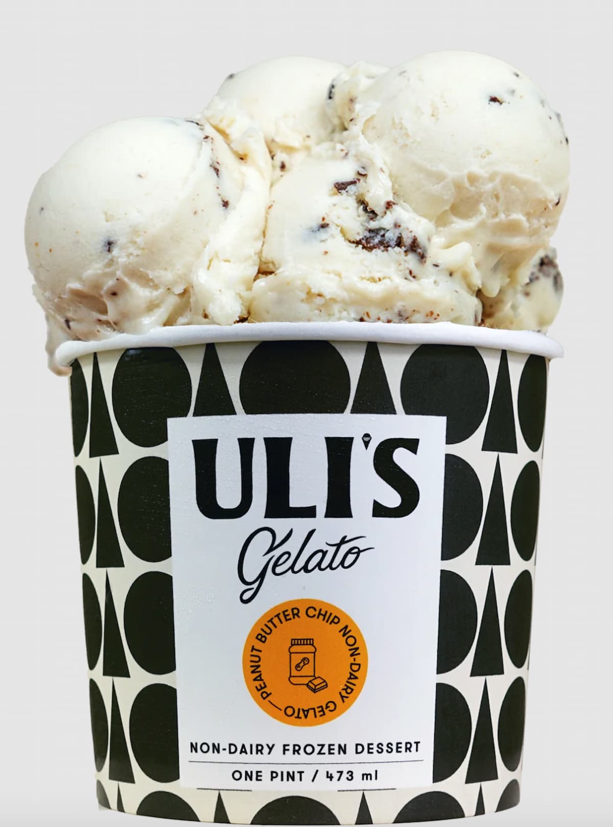 An overflowing pint of Uli's dairy-free gelato in black and white print against a gray background.