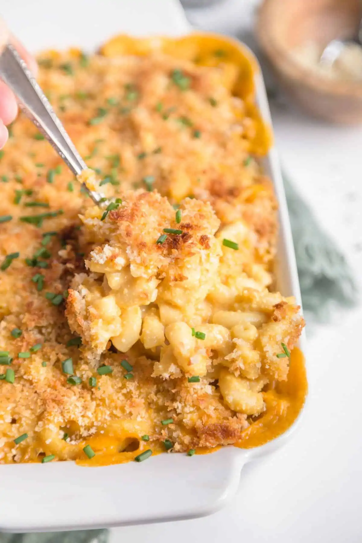 Baked vegan mac and cheese casserole in a white dish, classic American comfort cuisine.