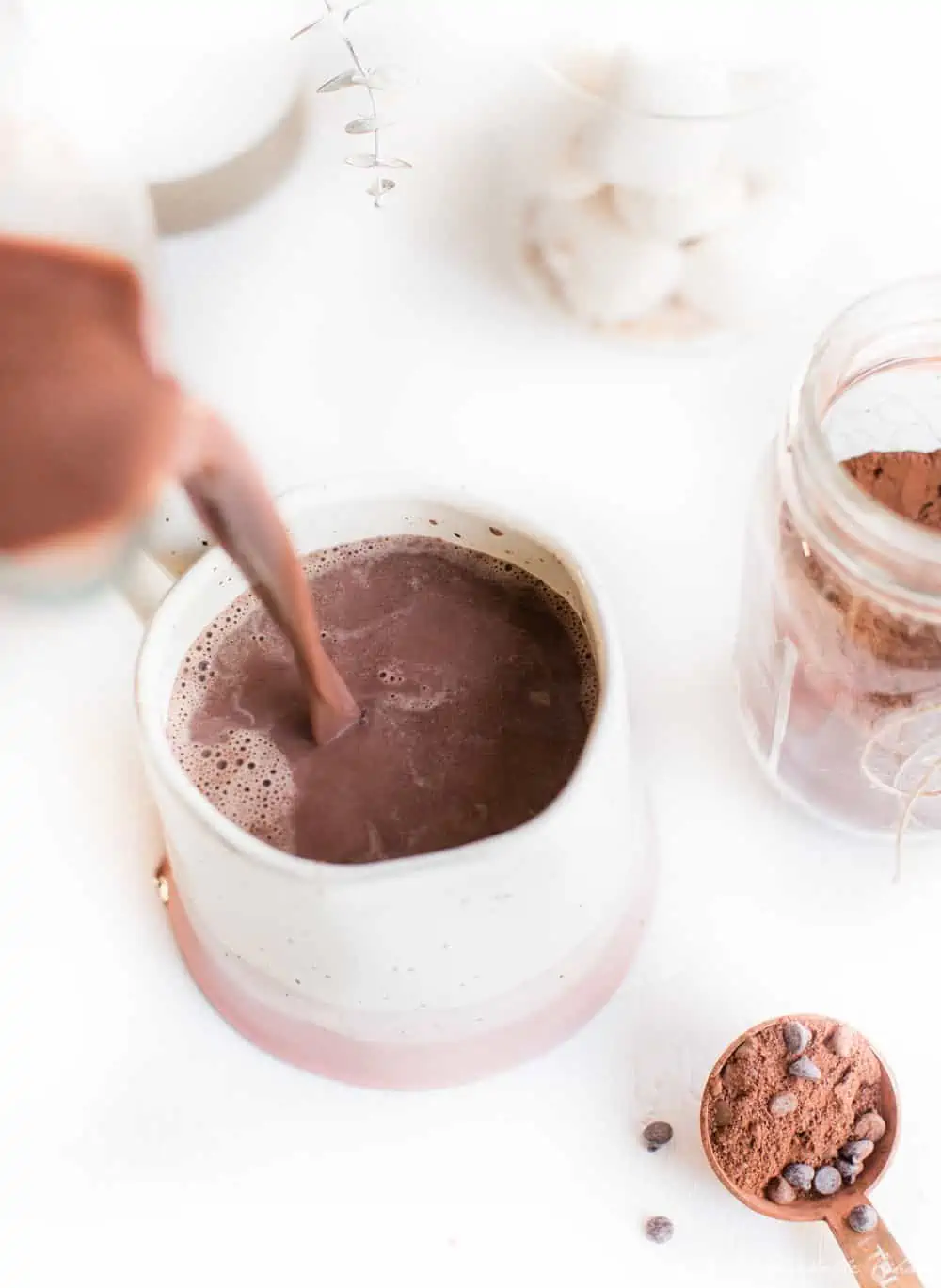 Pouring Vegan Hot Chocolate into a mug.