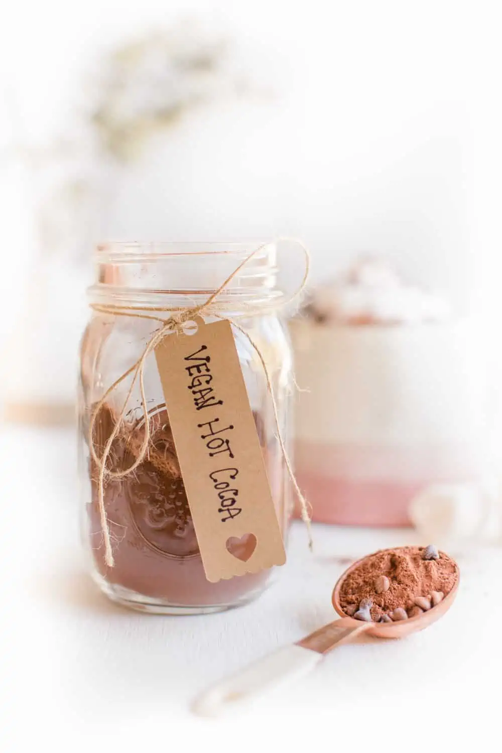 Vegan hot cocoa powder in a mason jar for hot chocolate.