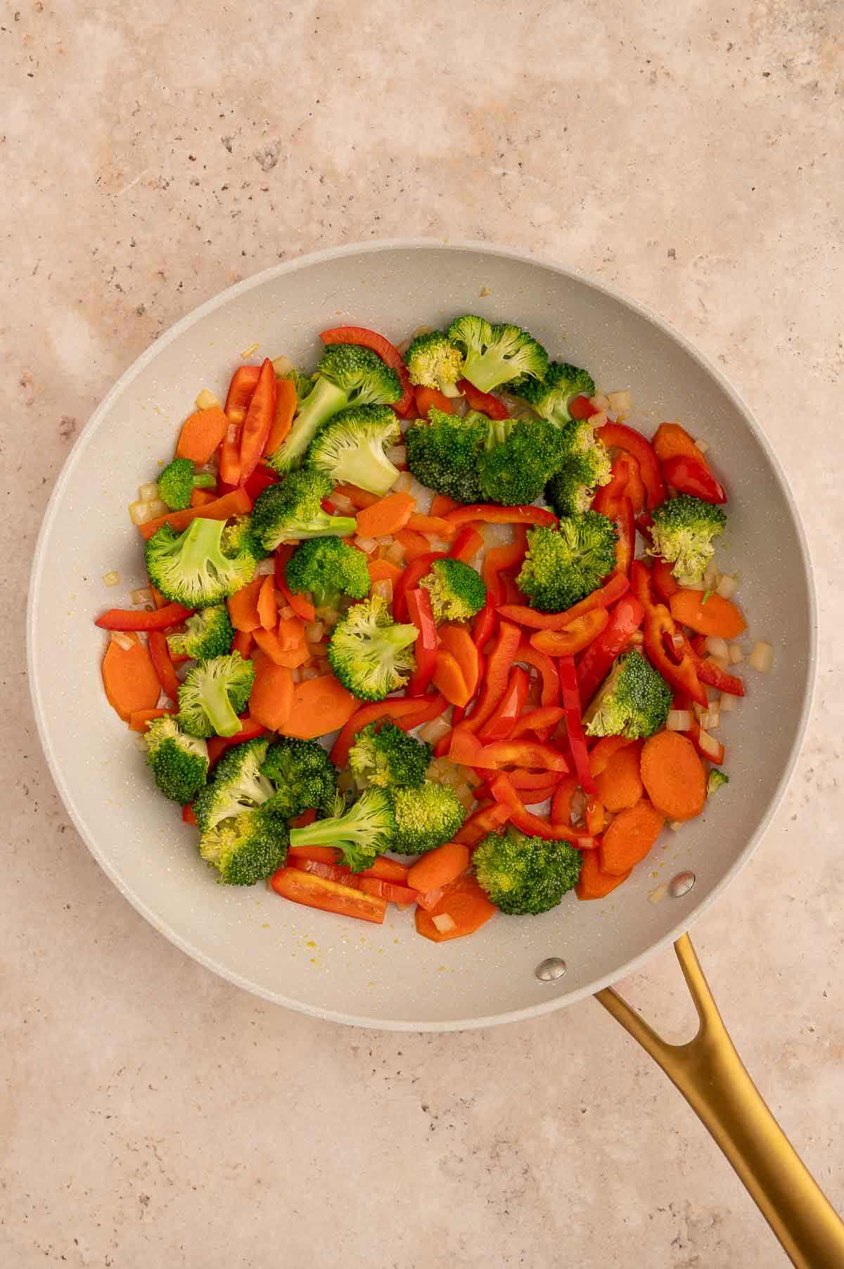 Vegan panang curry vegetables after stir frying in a pan.