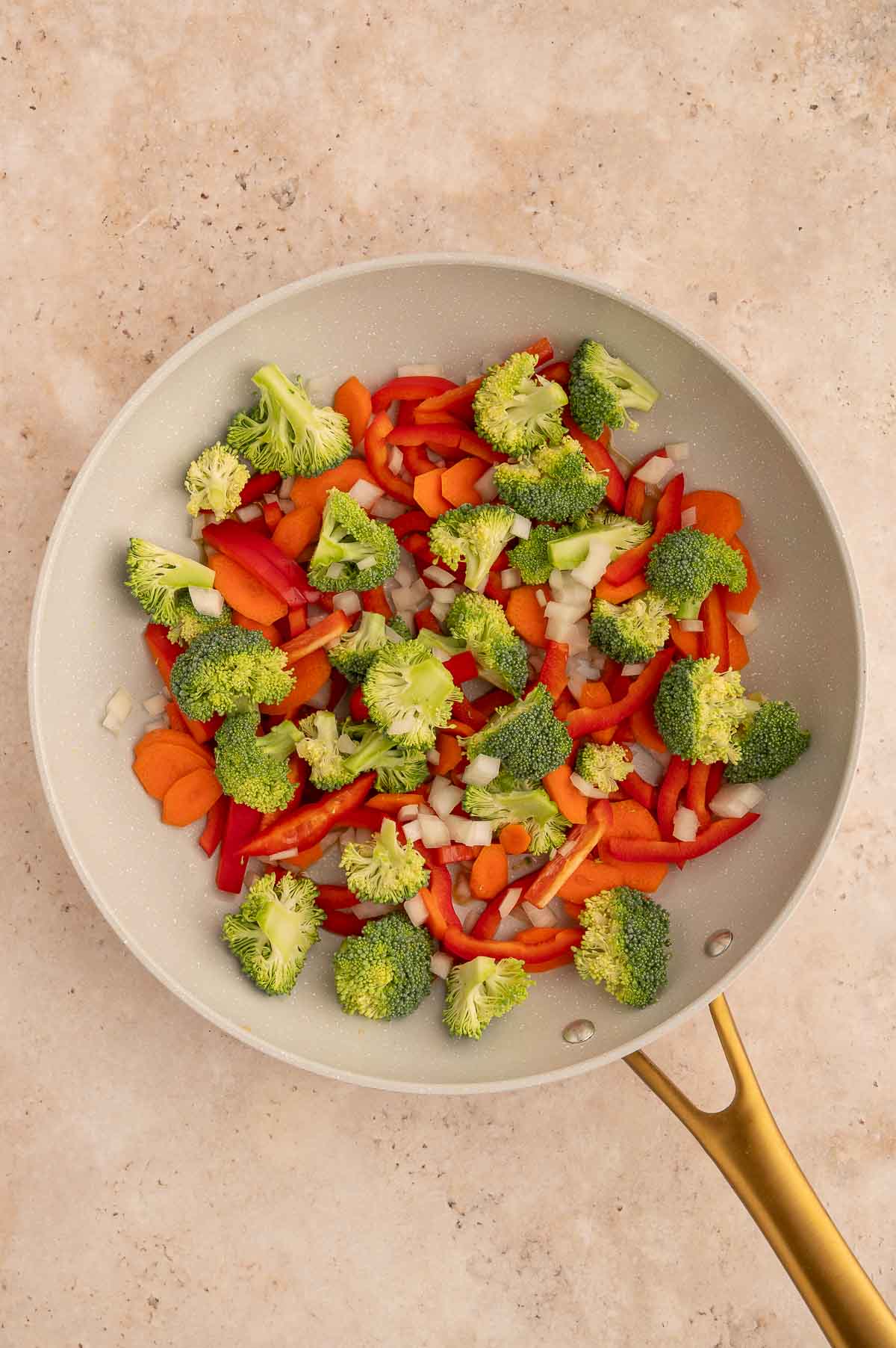 Raw chopped and sliced veggies before stir frying for a vegan panang curry recipe.