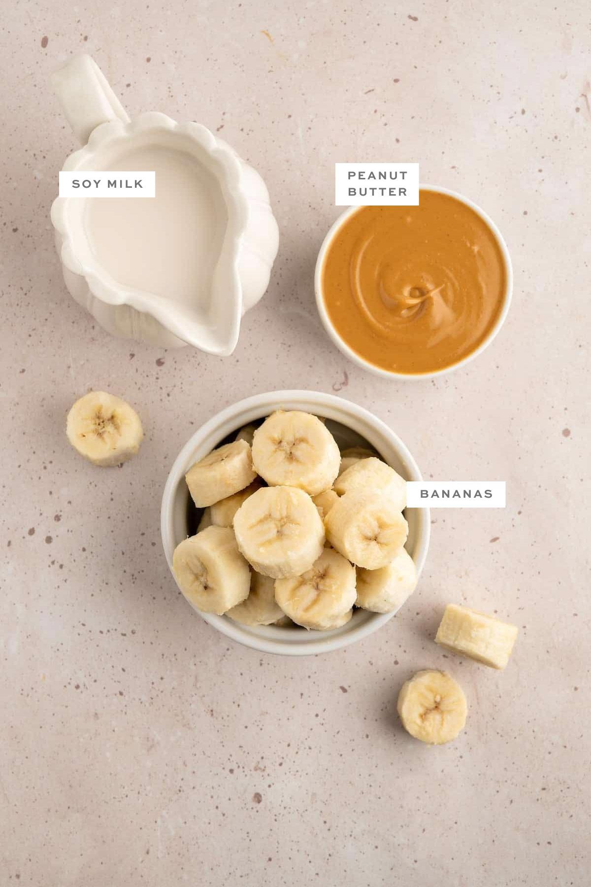Ingredients for a vegan banana milkshake with labels.