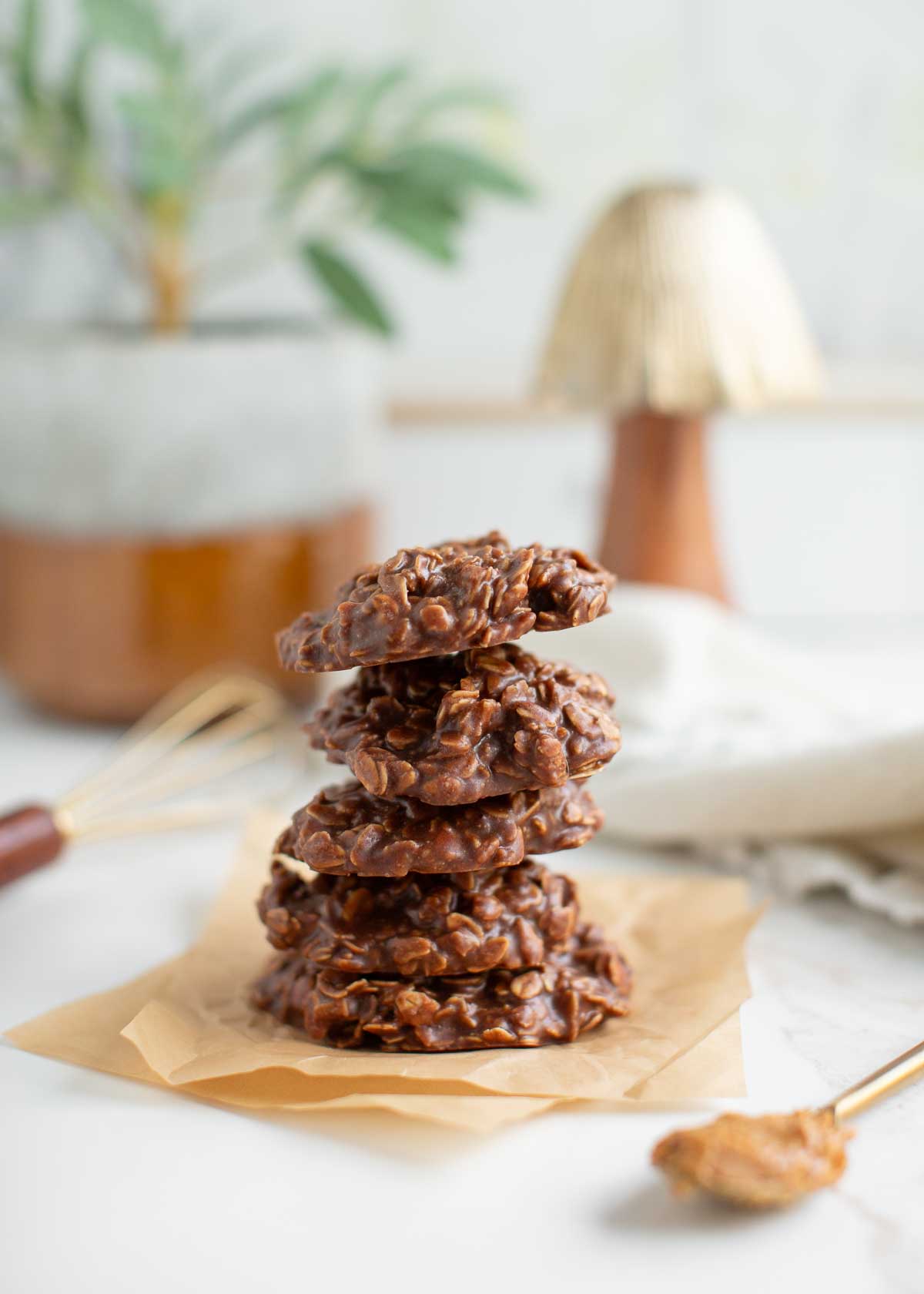 Vegan no-bake cookies with spoon and whisk.
