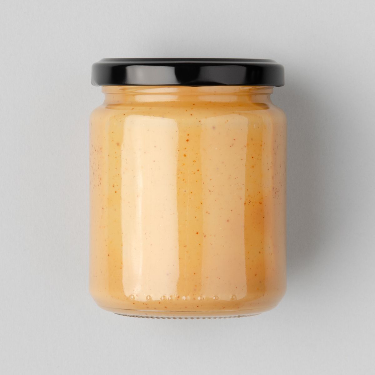 A jar of almond butter, one of the most indispensable vegan pantry essentials.