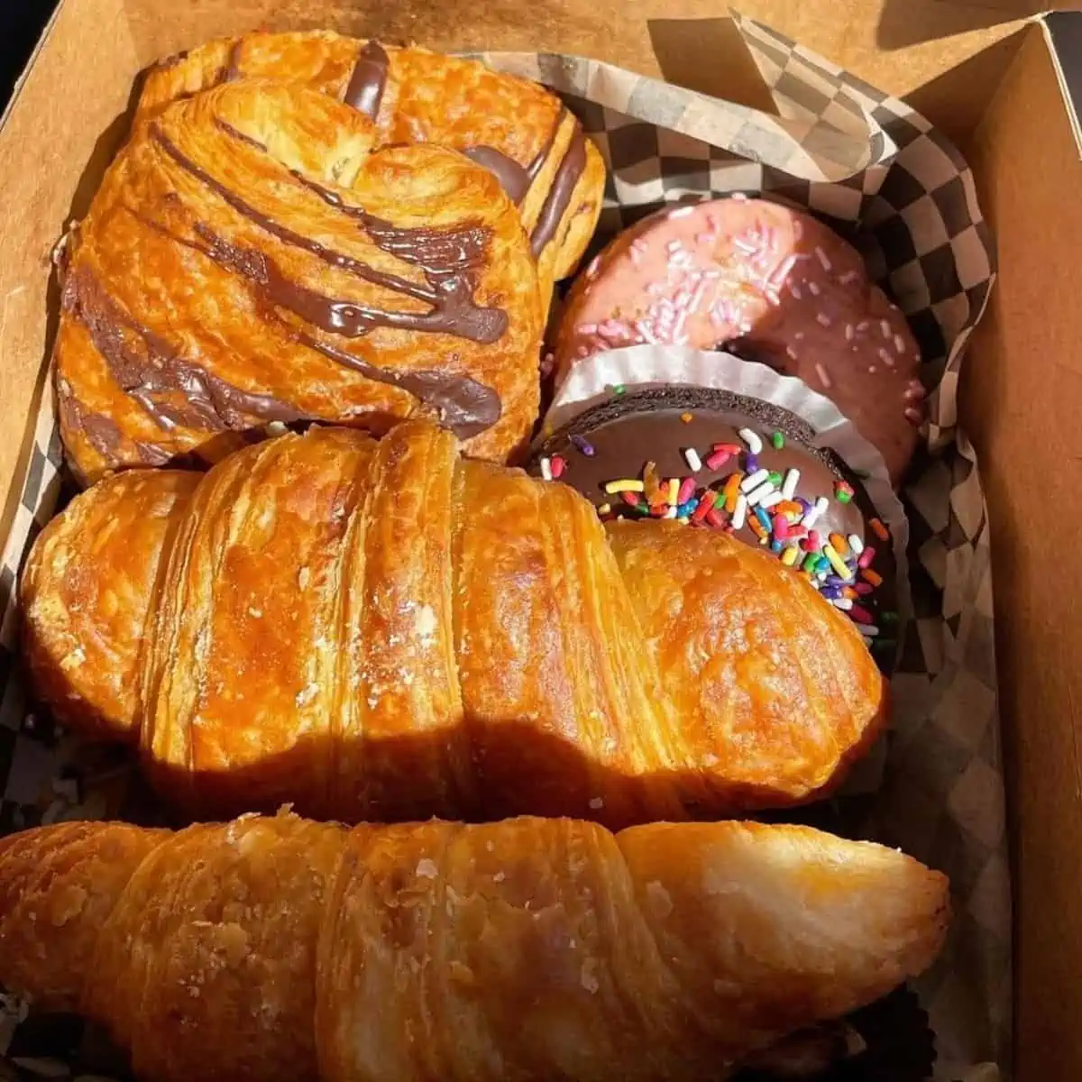 Box of vegan croissants, pastries, and donuts from Timeless Coffee in Oakland.