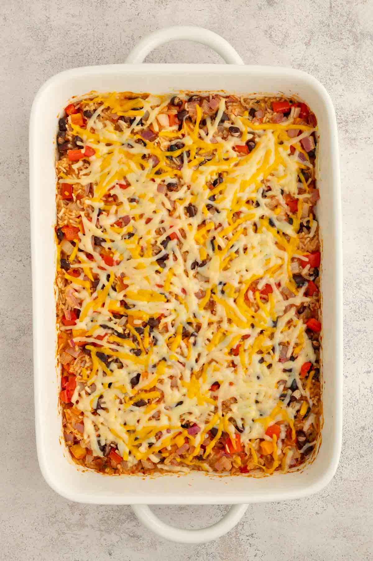 Bean and rice casserole with melted cheese on top.
