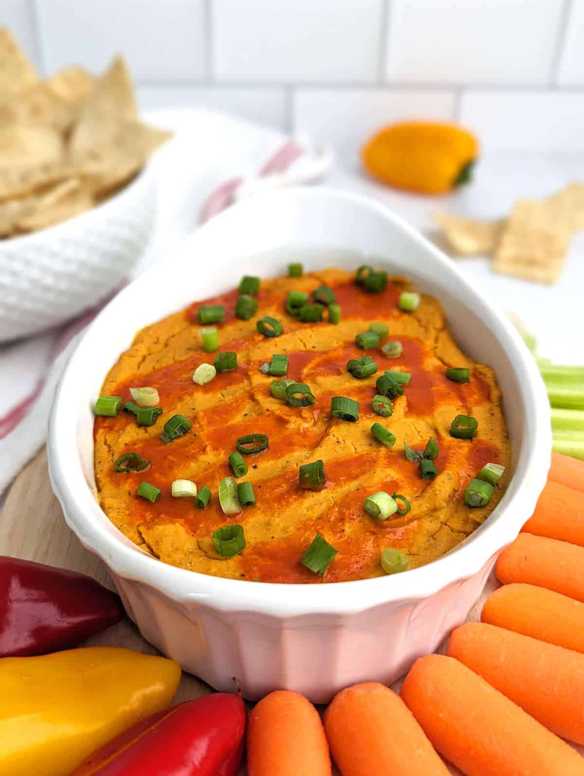 A bowl of buffalo chickpea dip, a healthy vegan snack.