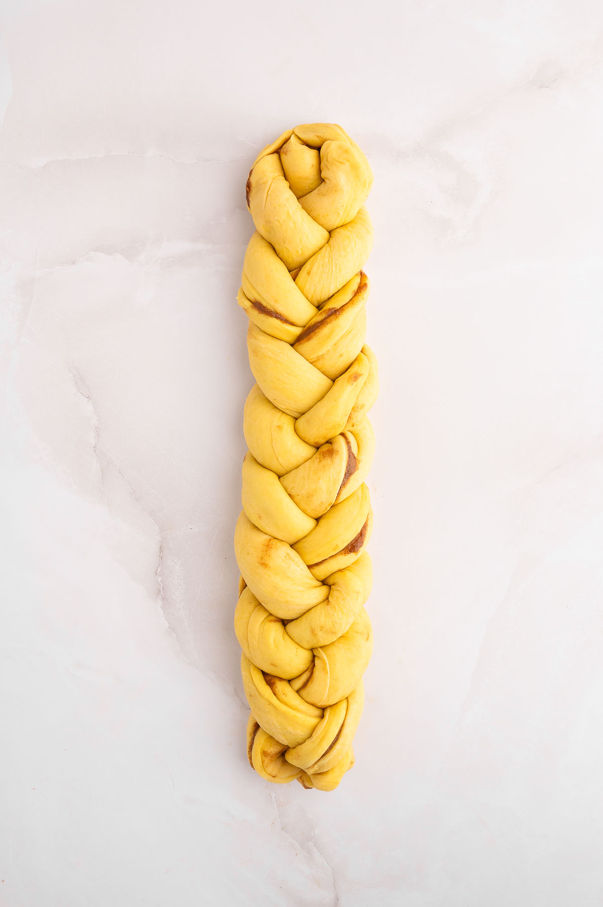 Cinnamon challah dough, braided.