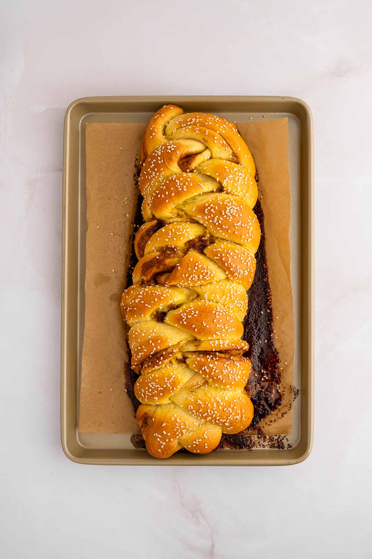Cinnamon challah on a baking sheet.