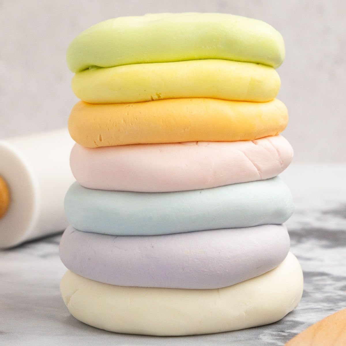 A stack of colored cloud dough spheres in a stack.