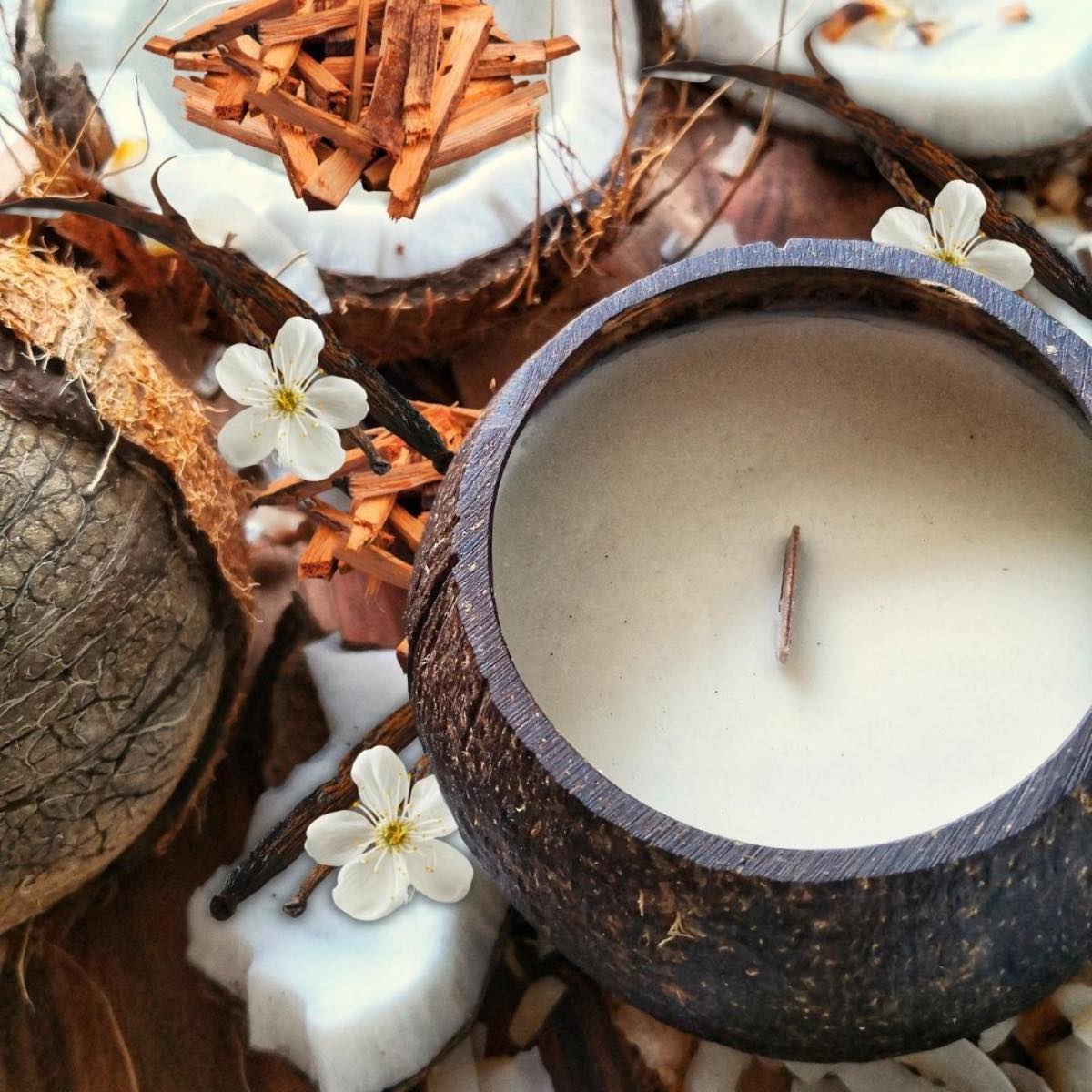 Beautiful rustic candle made from soy wax in a coconut bowl.