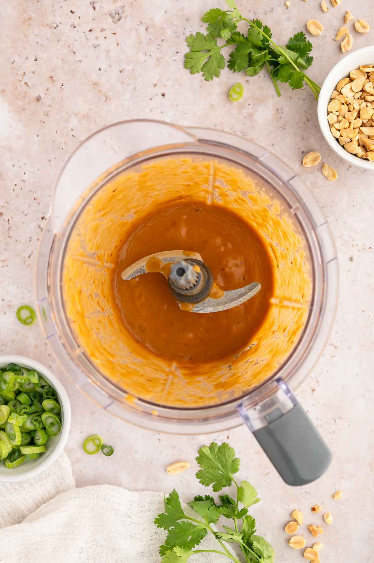The blended peanut sauce for the cold noodle salad in a food processor.