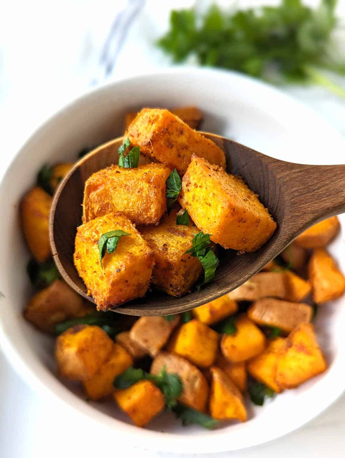 A spoonful of crispy, air-fried potatoes.