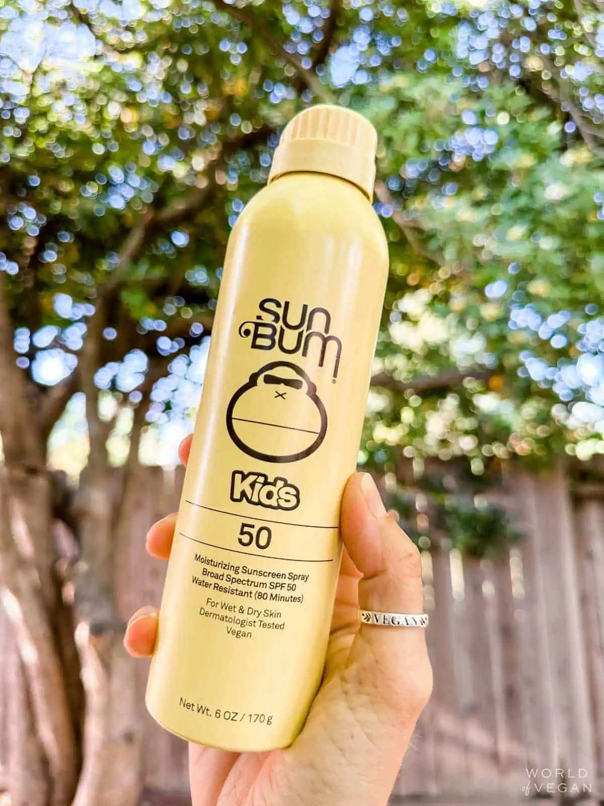 Yellow bottle of kids spray sunscreen from Sun Bum.