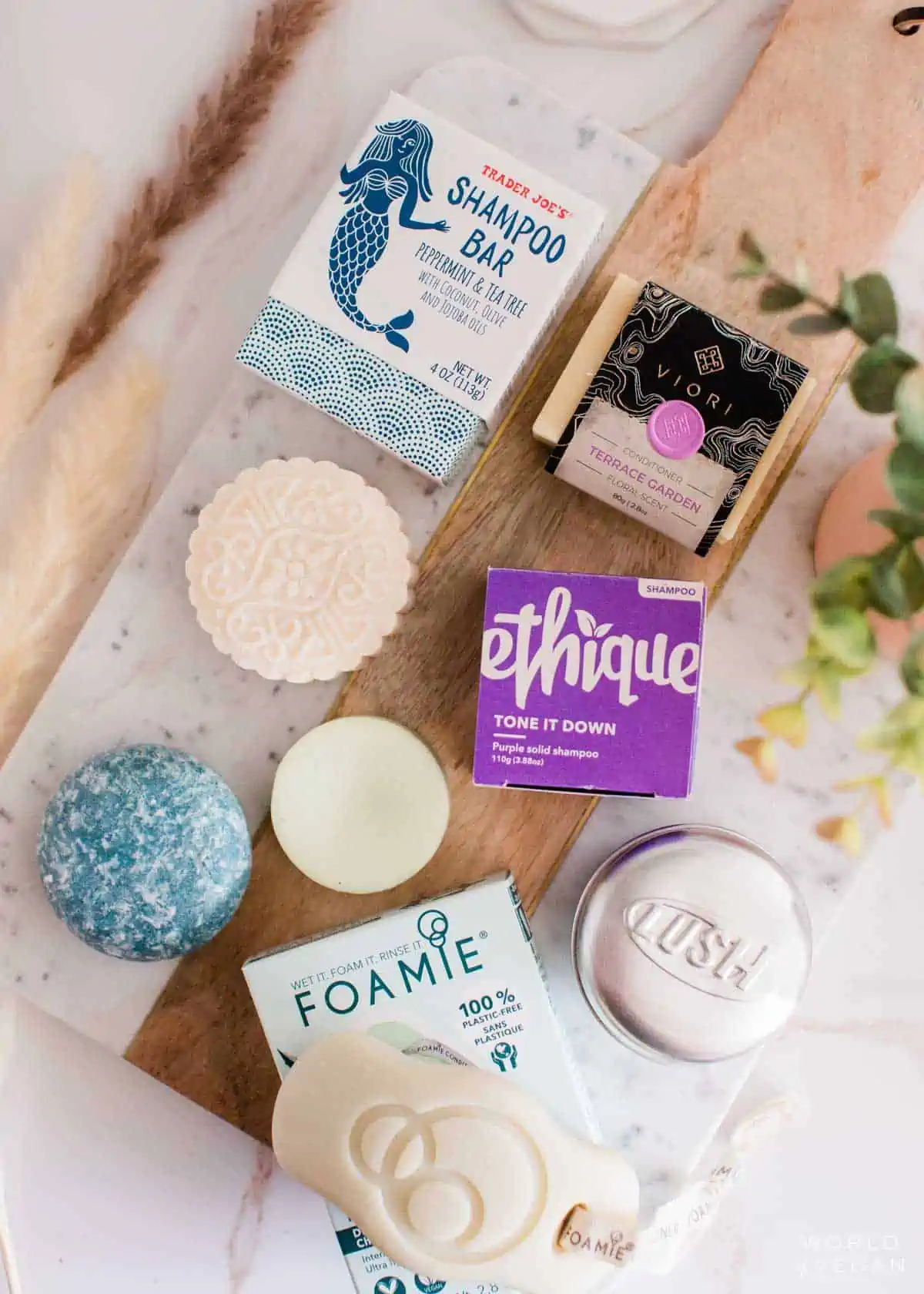 Cruelty free brands of sustainable shampoo bars on the bathroom counter.