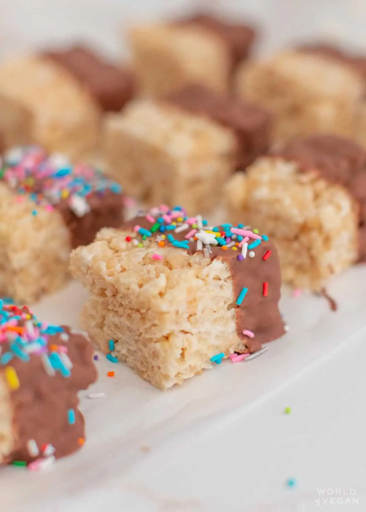 Close-up of vegan chocolate rice crispy treat topped with vegan sprinkles.