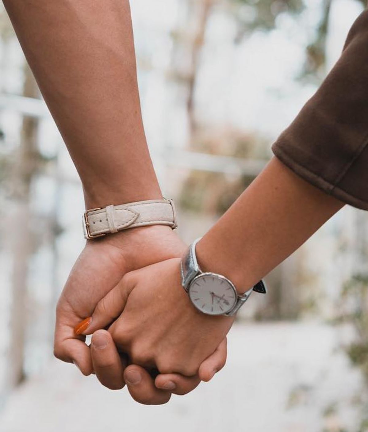 A couple holding hands.