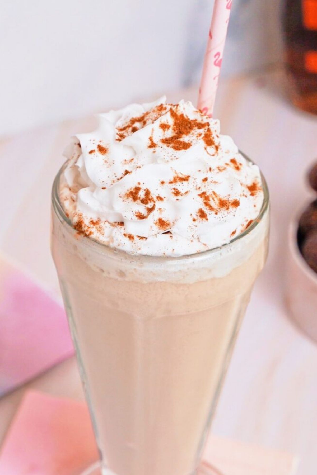 A dairy-free milkshake with vegan whipped cream.