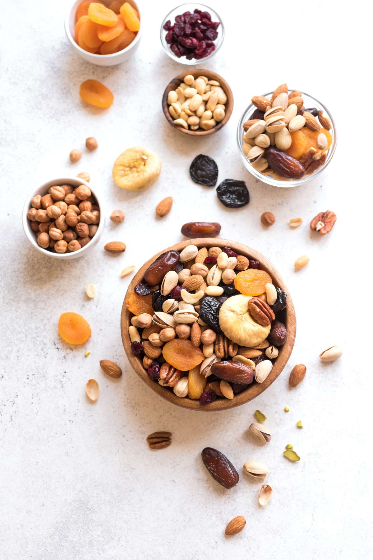 Dried fruit and nuts in bowls.