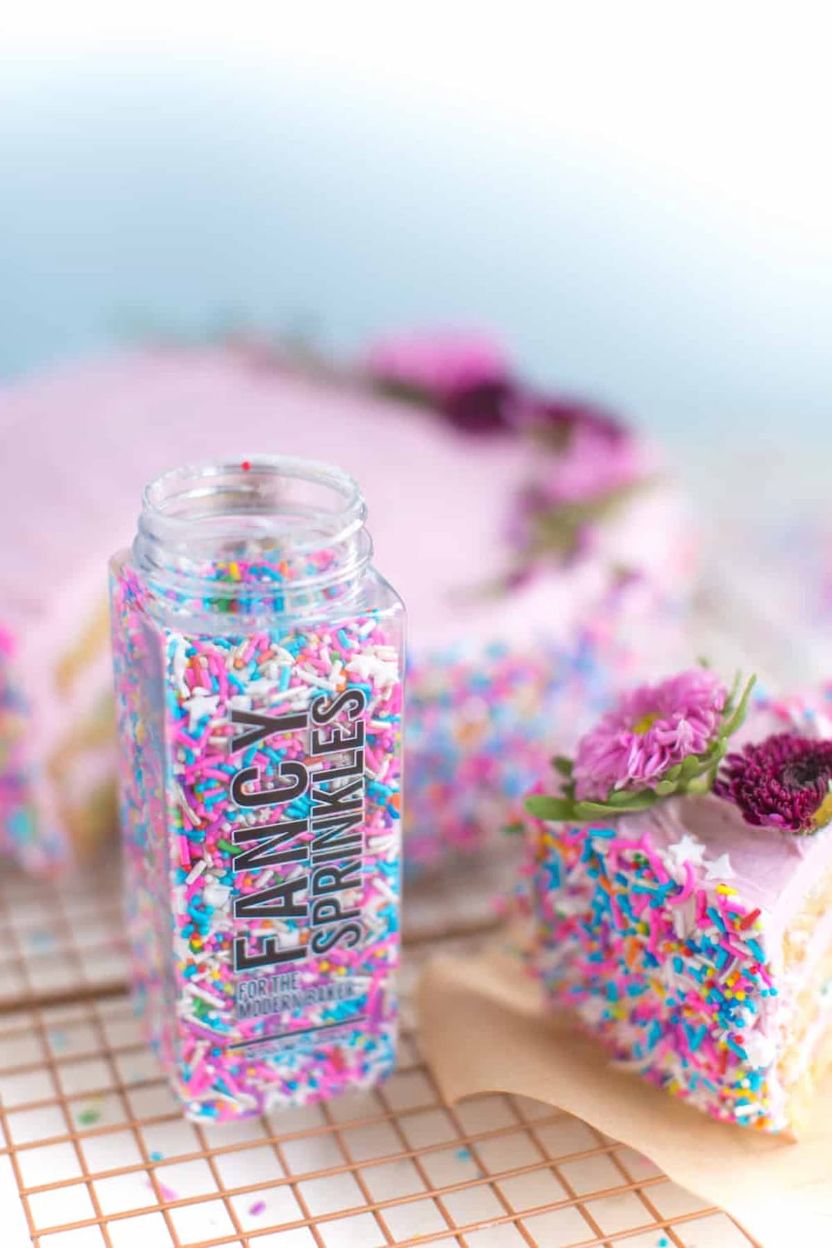 A small jar of Fancy Sprinkles brand vegan sprinkles.