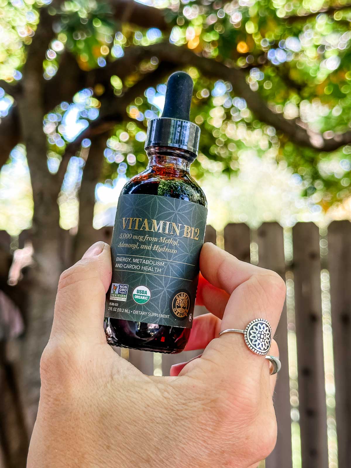 A bottle of Global Healing brand vegan vitamin b12 spray.