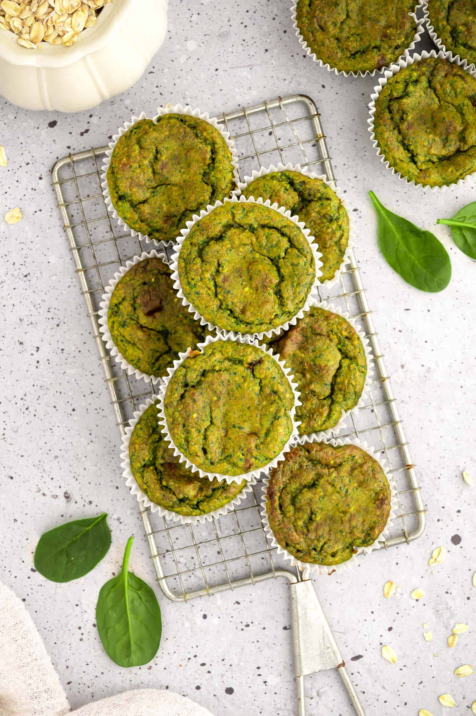Toddler-friendly green vegan muffins made with spinach and banana.