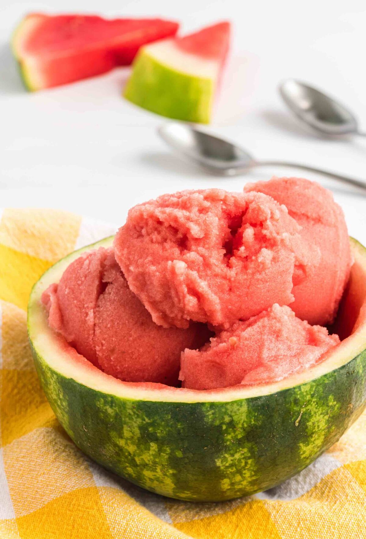 Vegan watermelon gelato served in a hollowed-out watermelon bowl—icy, sweet, and refreshing.