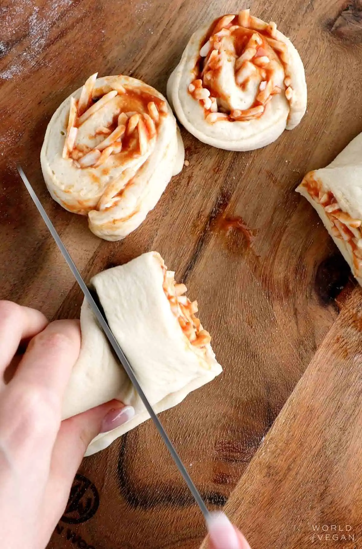 Showing how to sliced pizza rolls.