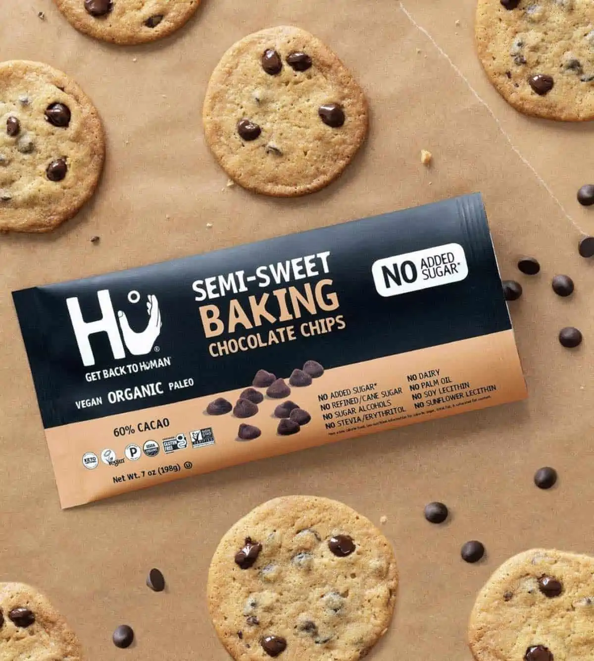 Hu brand bag of semi sweet vegan chocolate chip cookies sugar free surrounded by cookies.